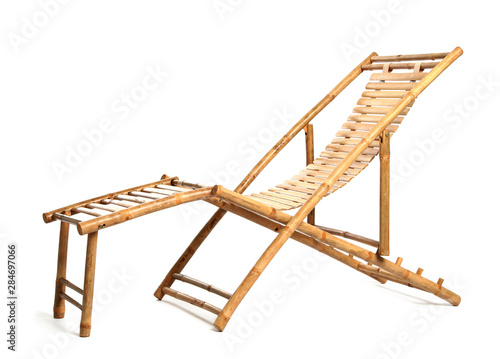 Empty wooden beach sunbed on white background © New Africa