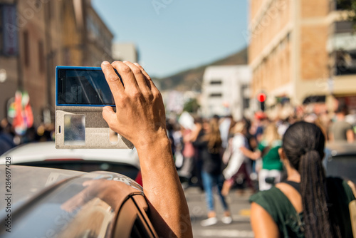 Crowd being filmed on mobile phone