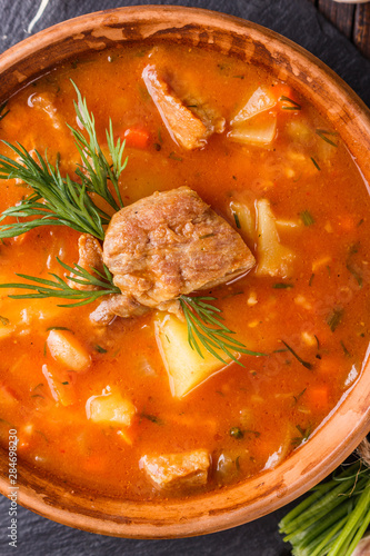 Chanahi a traditional Georgian meat stew in a bowl on stoyn board photo