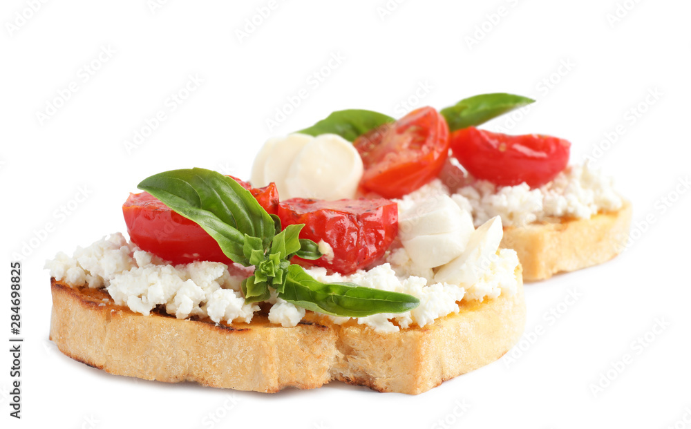 Tasty fresh tomato bruschettas on white background