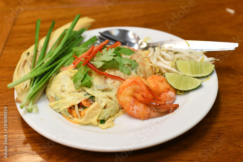 Pad Thai with shrimp wrapped in egg