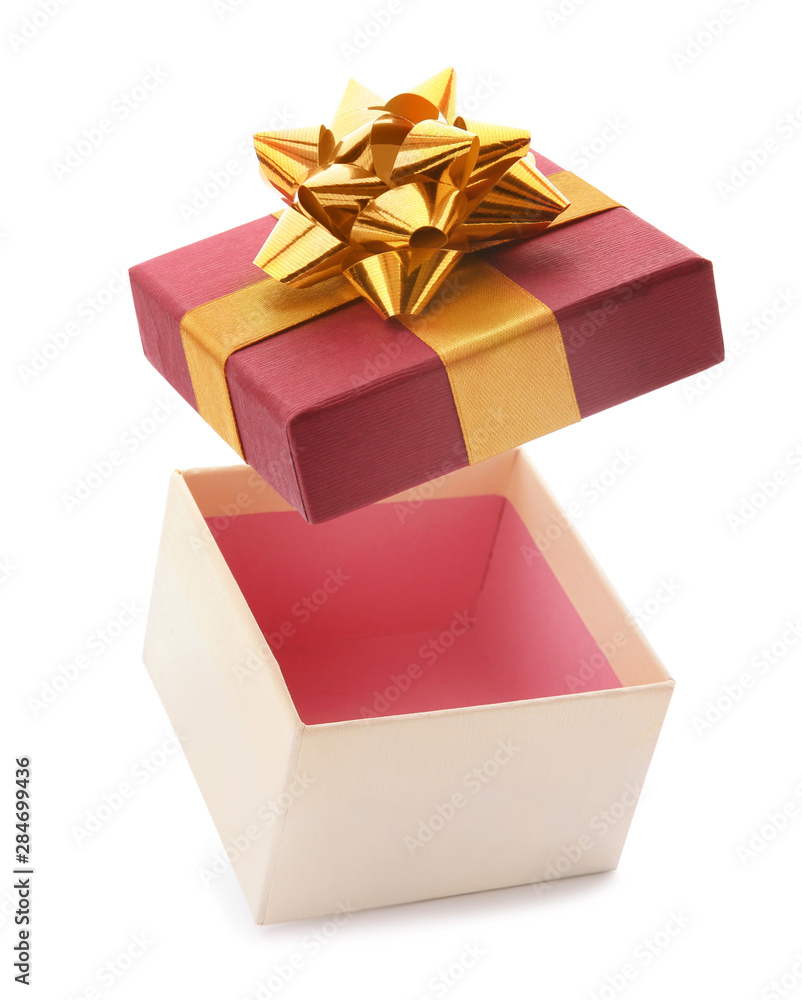 Naklejka premium Open empty gift box with bow on white background