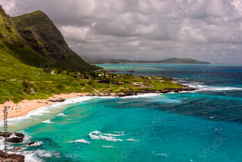 A view of Makapu'u beach, on the east side of Oahu, Hawaii. The day is sunny and the sky is blue