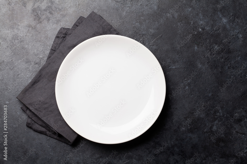 Kitchen table with empty plate and towel - obrazy, fototapety, plakaty 