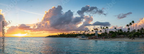 Panorama of dramatic sunset at Bayahibe Beach, La Romana, Dominican republic. photo
