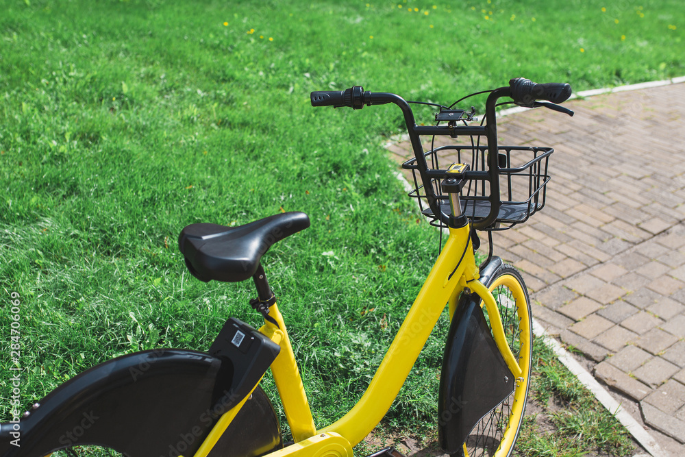 Yellow city bike with a basket - walk around the city