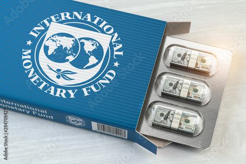 IMF International Monetary Fund tranches concept. Pack of dollars as pills in blister pack. photo