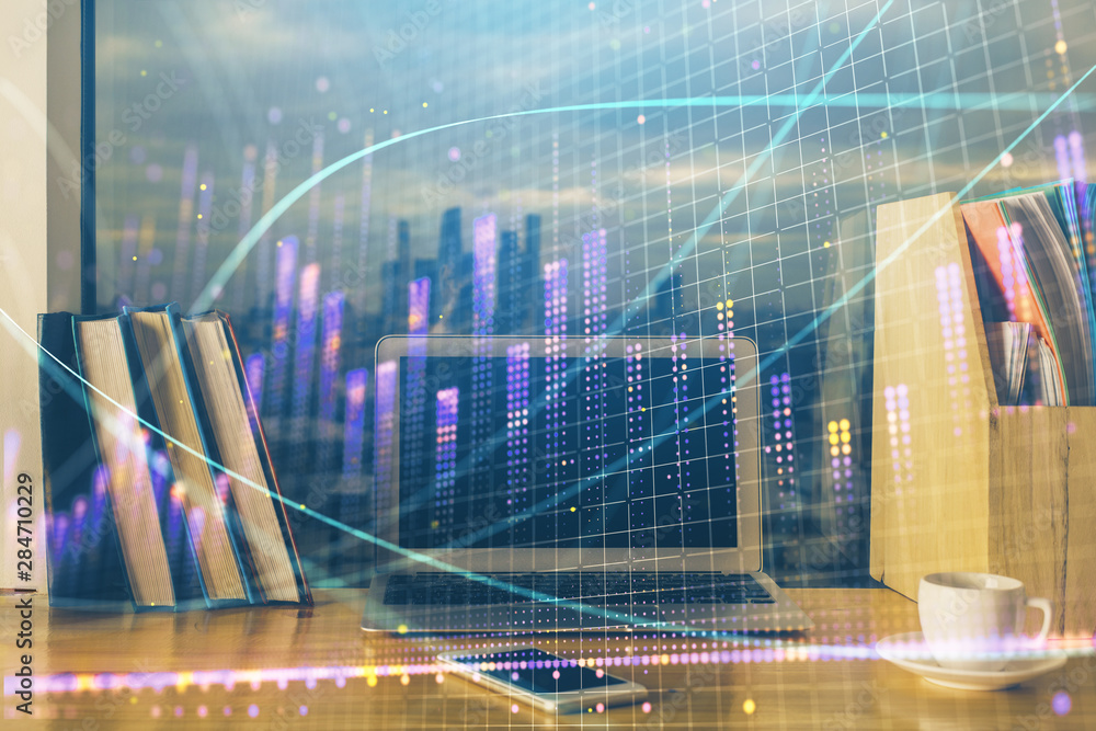 Stock market graph on background with desk and personal computer. Double exposure. Concept of financial analysis. Stock market graph on background with desk and personal computer. Double exposure. Concept of financial analysis.