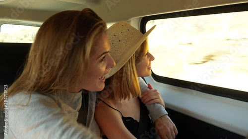 Pretty Female Models Talking in a Van Enjoying the Scenery