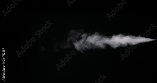 Stream of smoke on black background