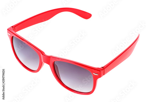 Women's red sunglasses isolated on a white background, close up.