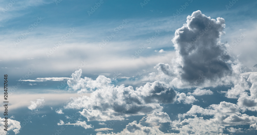 Fototapeta premium Dark thunderstorm and cirrus clouds in sky.
