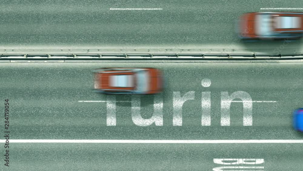 Aerial down view of the motorway with cars revealing Turin caption. Car travel to Italy intro clip Aerial down view of the motorway with cars revealing Turin caption. Car travel to Italy intro clip