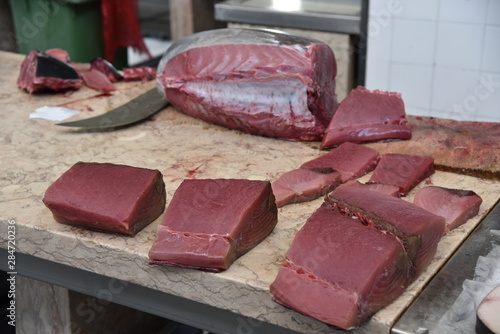 Fresh raw tuna meat (Thunnus thynnussold) sold in the fish market.