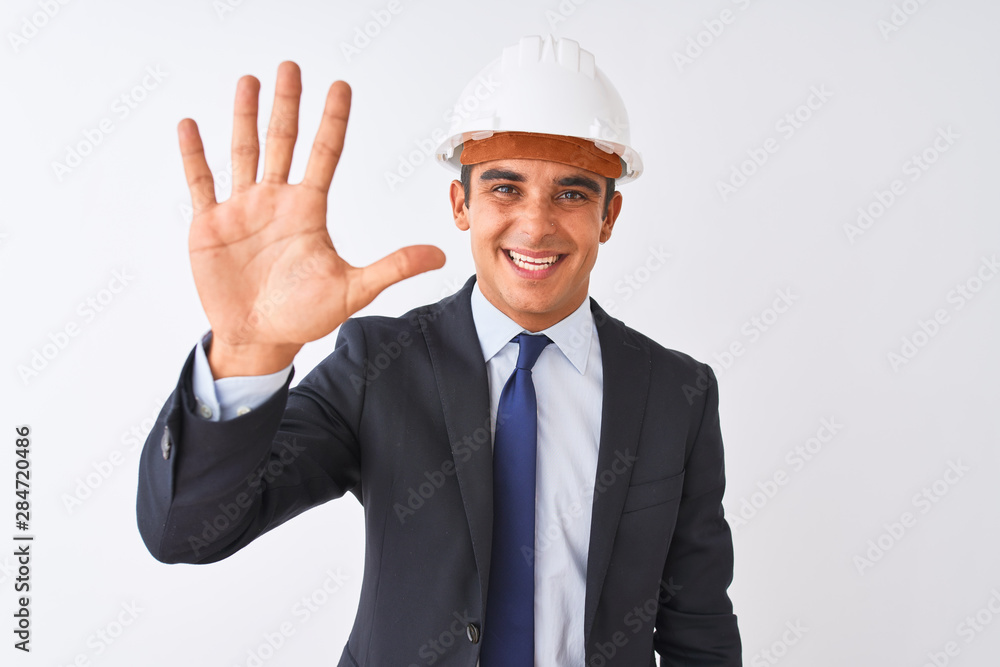 Young handsome architect man wearing suit and helmet over isolated white background showing and pointing up with fingers number five while smiling confident and happy. Young handsome architect man wearing suit and helmet over isolated white background showing and pointing up with fingers number five while smiling confident and happy.