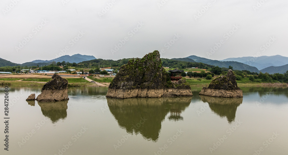 Panorama of Dodamsambong Peaks. Three stone peaks rising out of the Namhangang River. Danyang, North Chungcheong, South Korea, Asia.