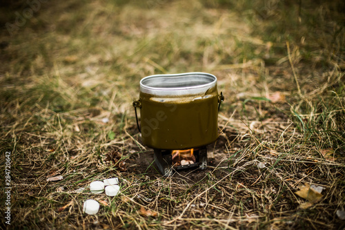 Water kettle on a camping / tourist stove photo