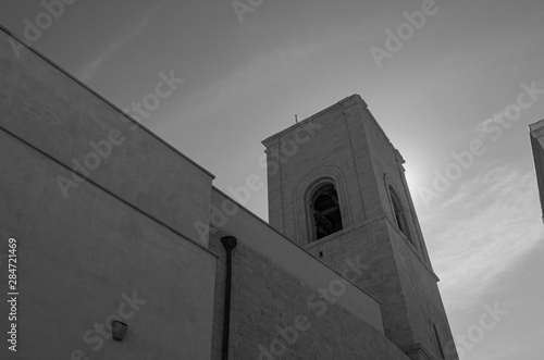 Polignano a Mare, mother church of S. Maria Assunta.  It rises in piazza V. Emanuele and the sober Romanesque facade is embellished on the portal with decorations of 1628. photo