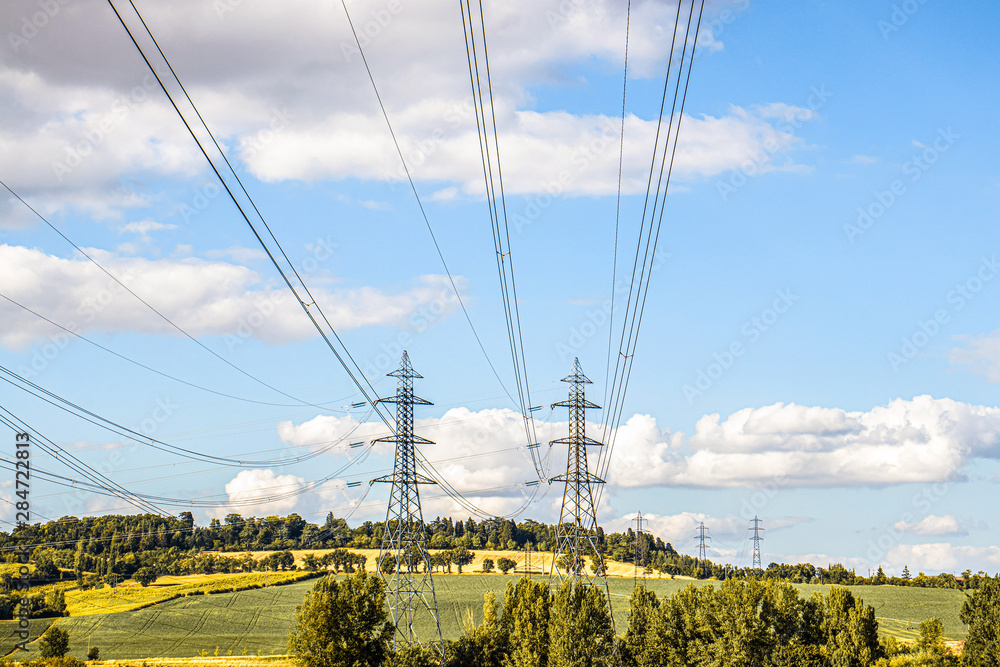 Beautiful landscape with electric lines and high voltage transmission towers