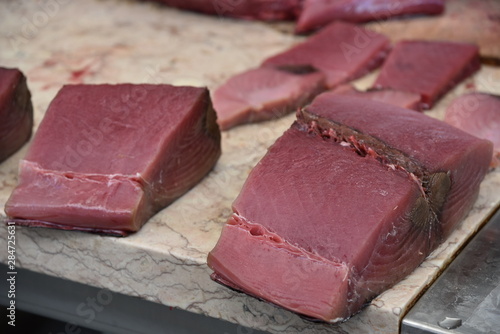 Fresh raw tuna meat (Thunnus thynnussold) sold in the fish market.