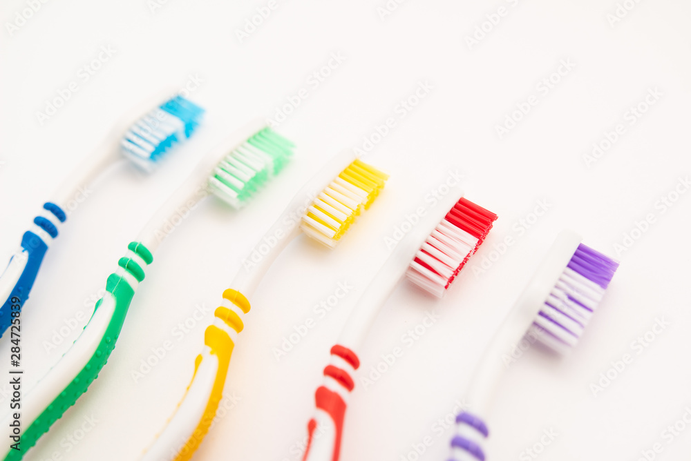 set of plastic toothbrushes on white background set of plastic toothbrushes on white background