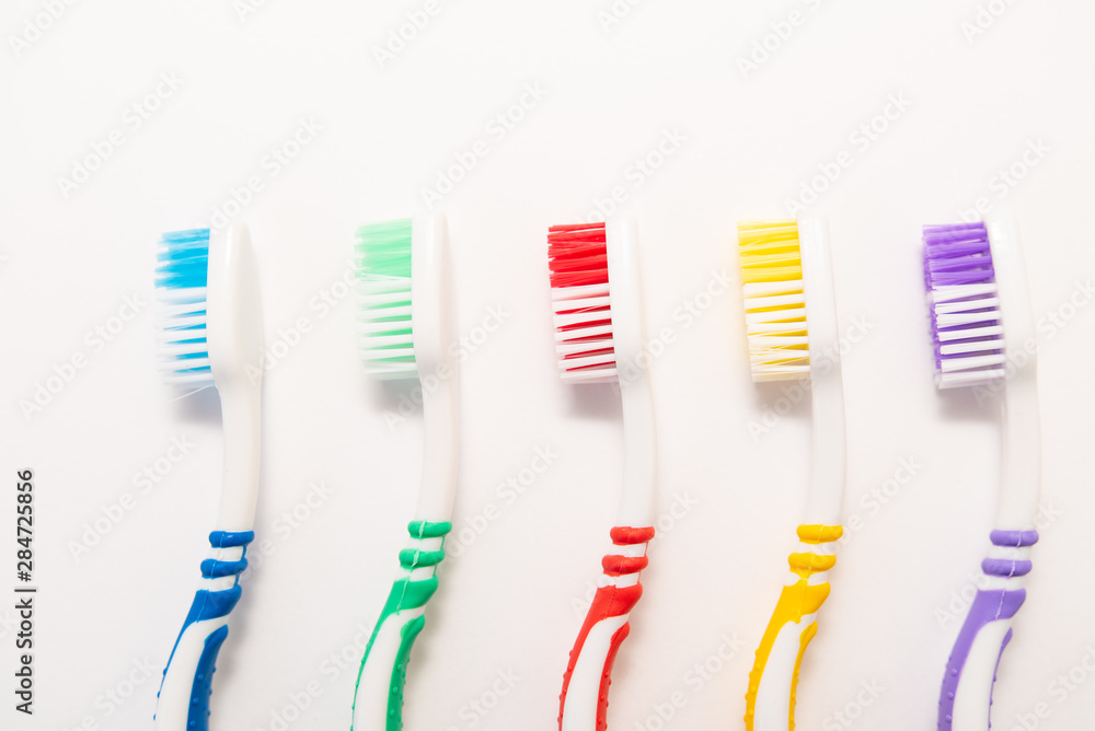 set of plastic toothbrushes on white background set of plastic toothbrushes on white background