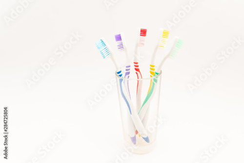 set of plastic toothbrushes on white background