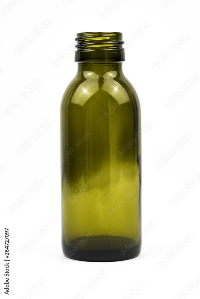 Little green glass bottle shot in a white studio. Little green glass bottle shot in a white studio.