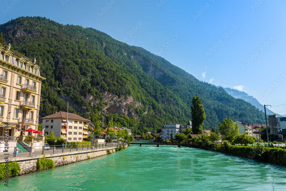 Beautiful landscape photo of River Aare with turqouise water in Interlaken, Switzerland.