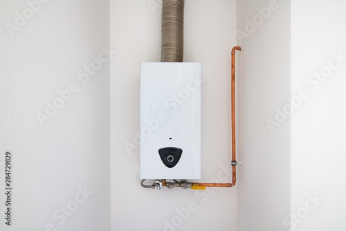 Obraz na płótnie Modern home gas water heater on the wall w salonie