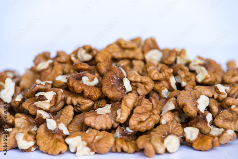 Walnuts whole and nuts on white background. Walnuts whole and nuts on white background.