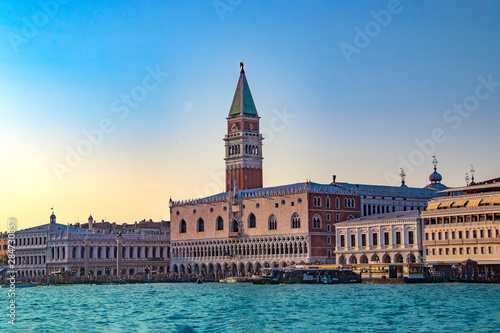 The magnificent view of Venice at sunset in Italy. There are blue sky and clear water. © Jana