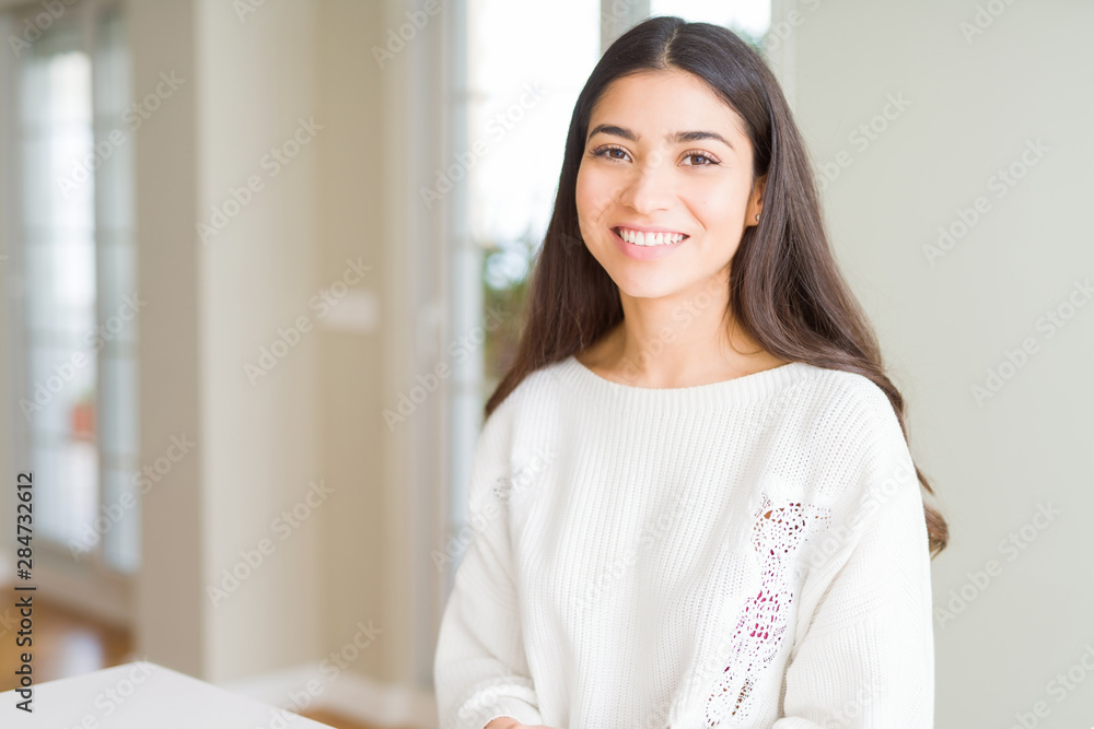 Beautiful brunette woman smiling cheerful with big smile, looking positive and happy Beautiful brunette woman smiling cheerful with big smile, looking positive and happy