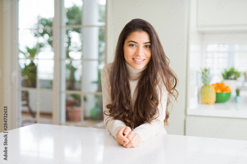 Beautiful brunette woman smiling cheerful with big smile, looking positive and happy Beautiful brunette woman smiling cheerful with big smile, looking positive and happy