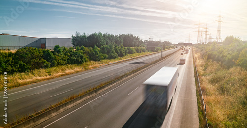 Lots of Trucks and cars on a Highway - transportation concept