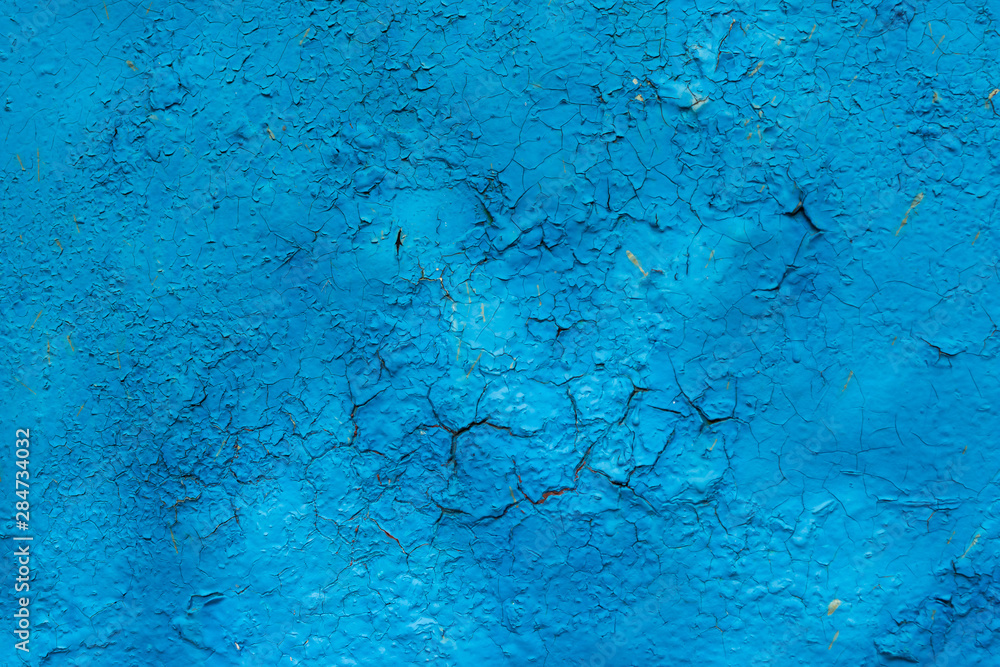 old rusty metal surface painted with peeling and cracked blue paint from time to time as an abstract background with large cracks old rusty metal surface painted with peeling and cracked blue paint from time to time as an abstract background with large cracks