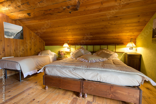Quadro em tela Interior shot of a mountain hut bedroom