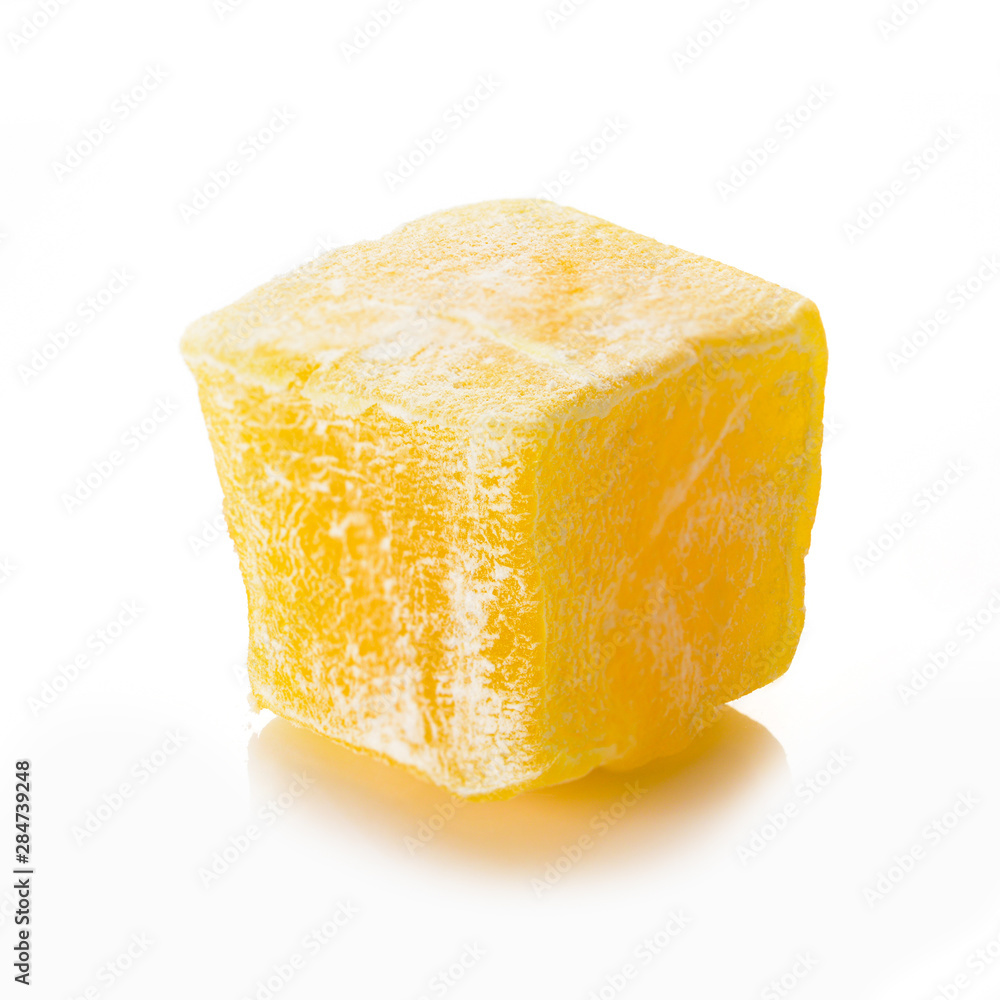 Turkish delight. Honey rahat locum, one piece of sweet oriental delights in powered sugar. Close-up view. Turkish delight. Honey rahat locum, one piece of sweet oriental delights in powered sugar. Close-up view.