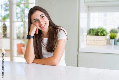 Beautiful young brunette woman smiling cheerful looking at the camera with a big smile on face showing teeth Free Download Beautiful young brunette woman smiling cheerful looking at the camera with a big smile on face showing teeth - GFXLoad