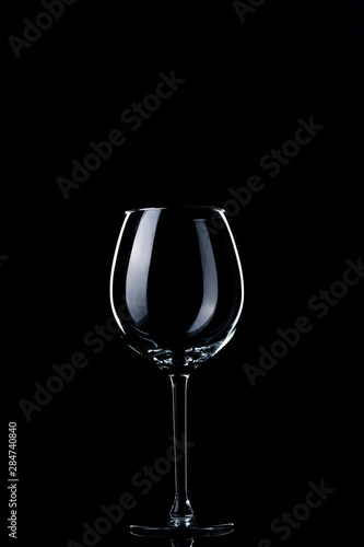 Glass of red wine on black background