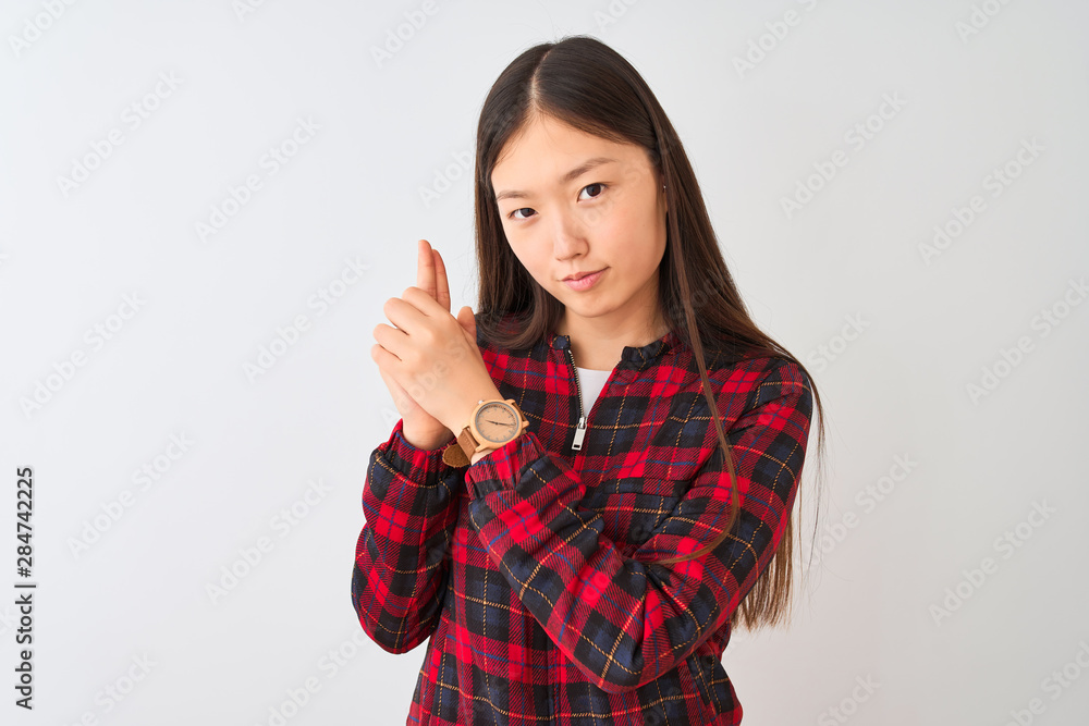 Young chinese woman wearing casual jacket standing over isolated white background Holding symbolic gun with hand gesture, playing killing shooting weapons, angry face Young chinese woman wearing casual jacket standing over isolated white background Holding symbolic gun with hand gesture, playing killing shooting weapons, angry face