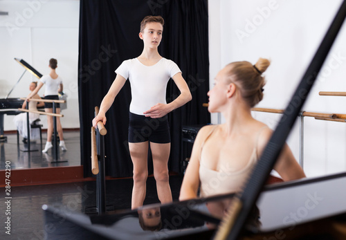 Young dancer studying ballet to the music