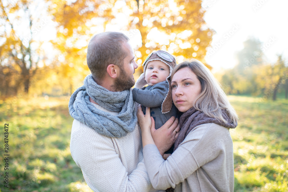 Happy family couple with child sincere emotions outdoor portrait. Happy family couple with child sincere emotions outdoor portrait.