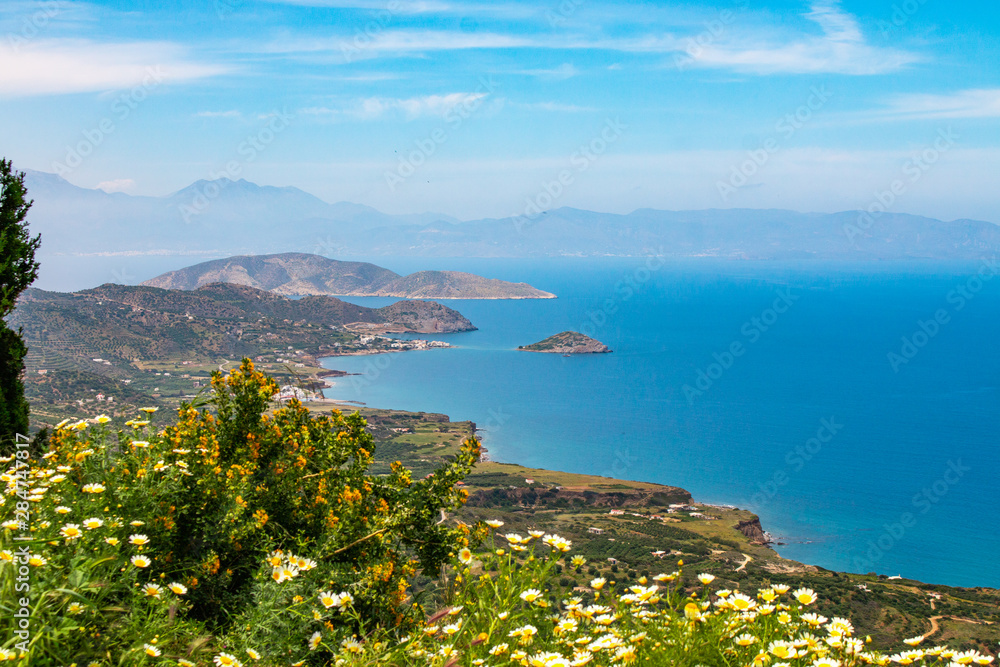 Beautiful view of the Mirabello bay. Near to Sitia and Agios Nikolaos. Landscape with turquoise sea, mountains and green nature.