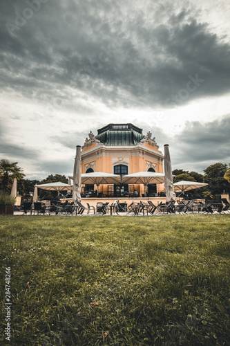 Photography Schoenbrunn zoo imperial pavilion cafe on a sunny crowded day among green bushes