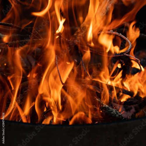 Flames Billow around campfire