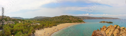 Vai beach, palm forest of Vai in Crete. Famous beach Vai panoramic with a beautiful palm forest. East Crete, Greece. Summer vacations.