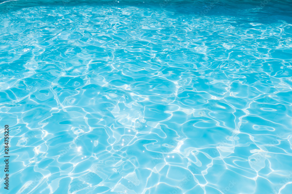 Obraz premium Blue and bright sea water surface with sunrefection, Water in swimming pool