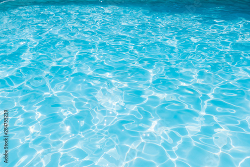 Blue and bright sea water surface with sunrefection, Water in swimming pool