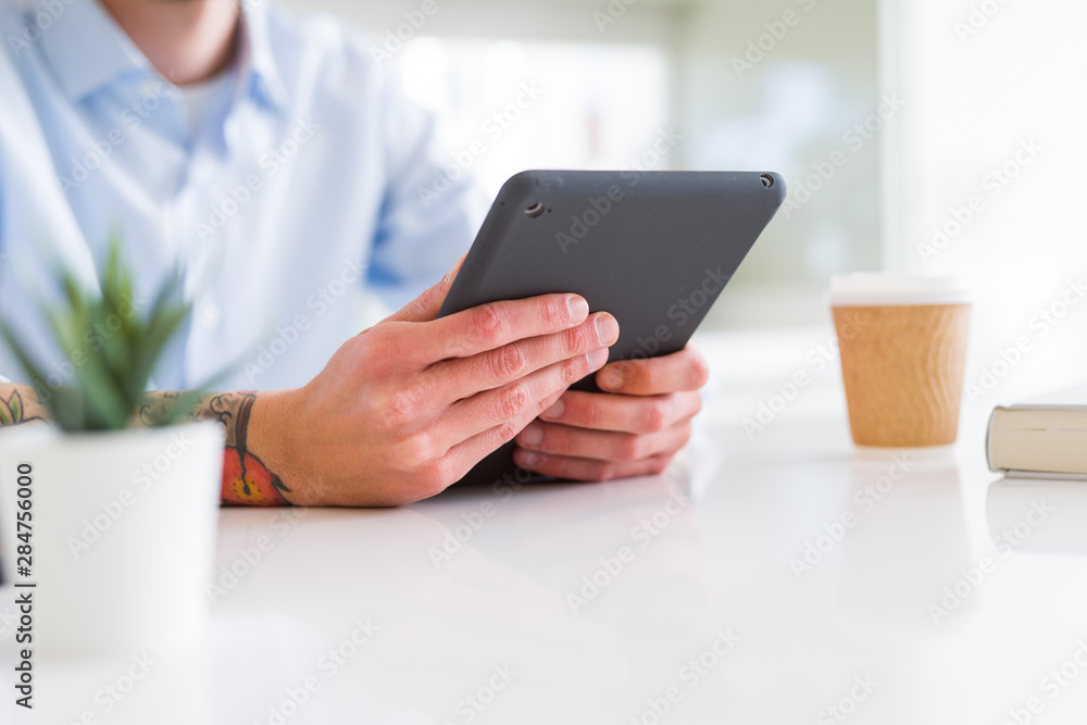 Close up of business man working using touchpad tablet Close up of business man working using touchpad tablet
